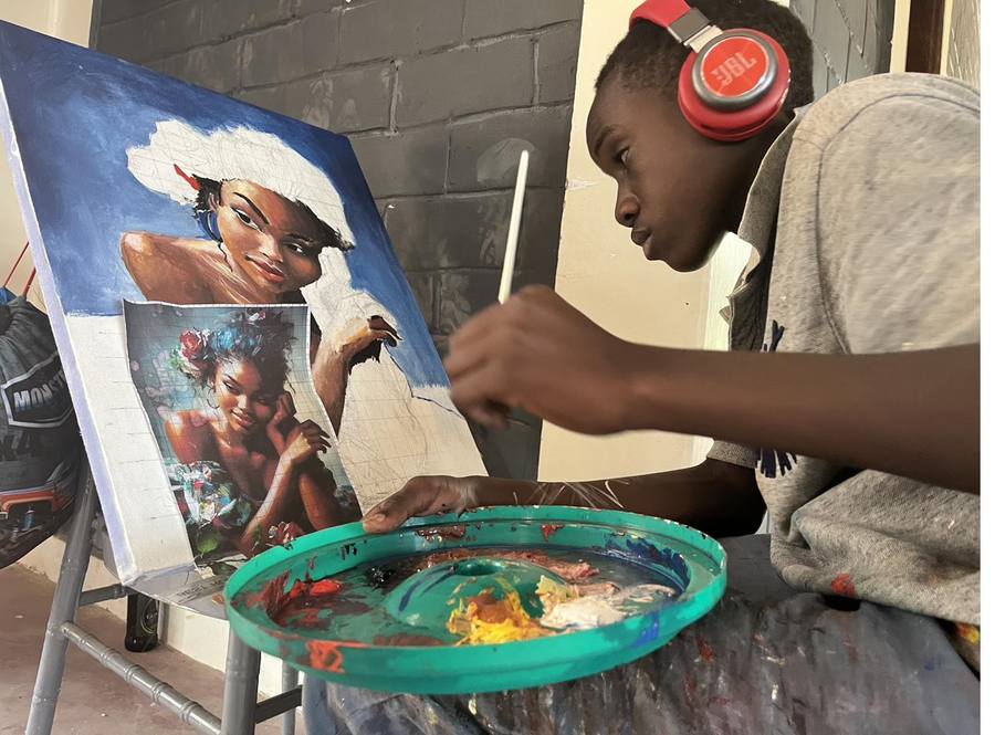 Young person painting at Yinnoh's Kwetu Culture programme
